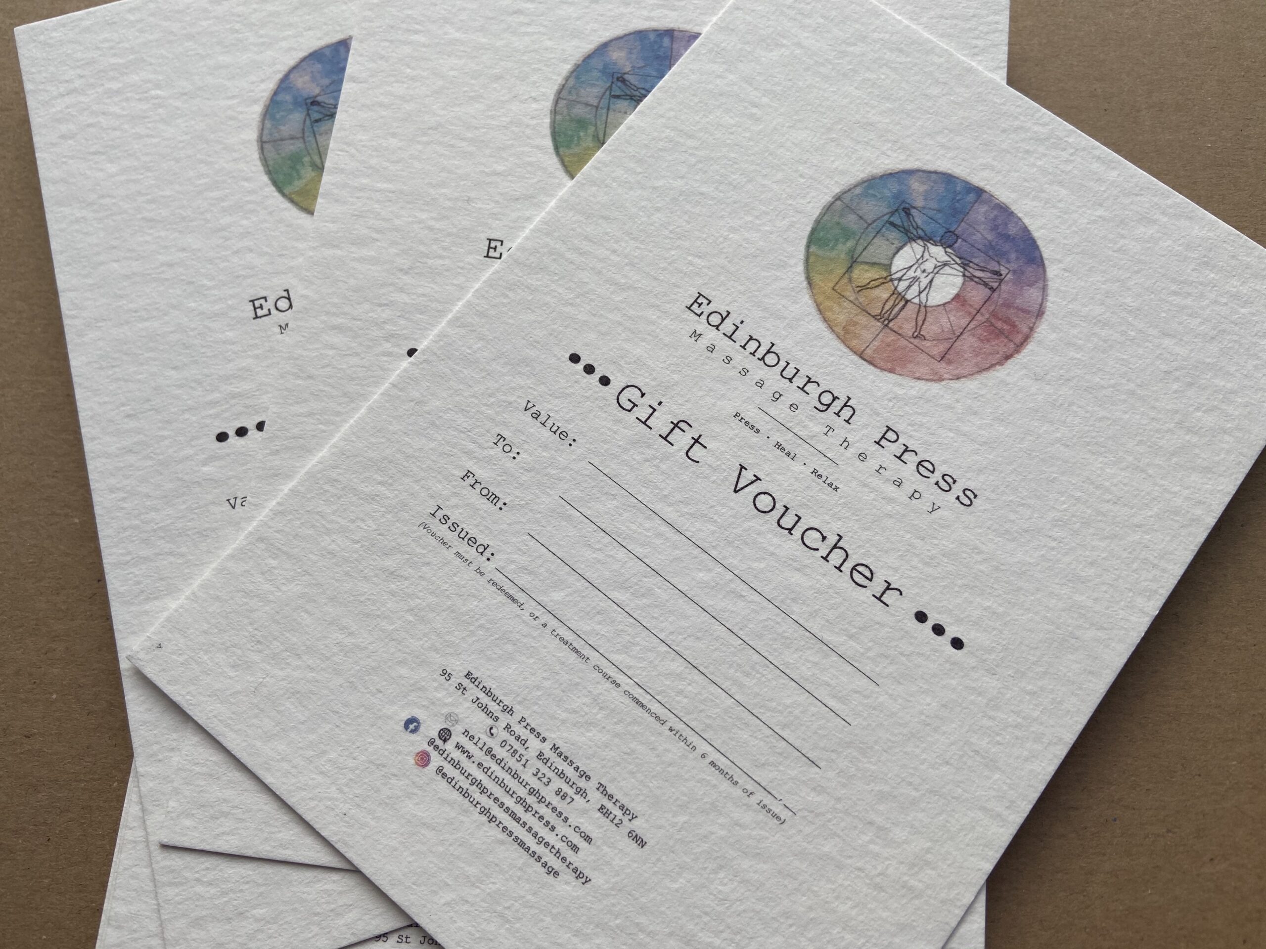 A fan display of three Edinburgh Press gift vouchers